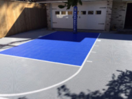 Bright blue and grey court with Duke pole pad