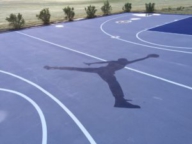Grey and blue court with "jump man" logo